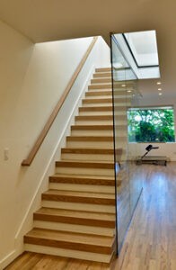 Glass stairway wall | Rockland Interiors