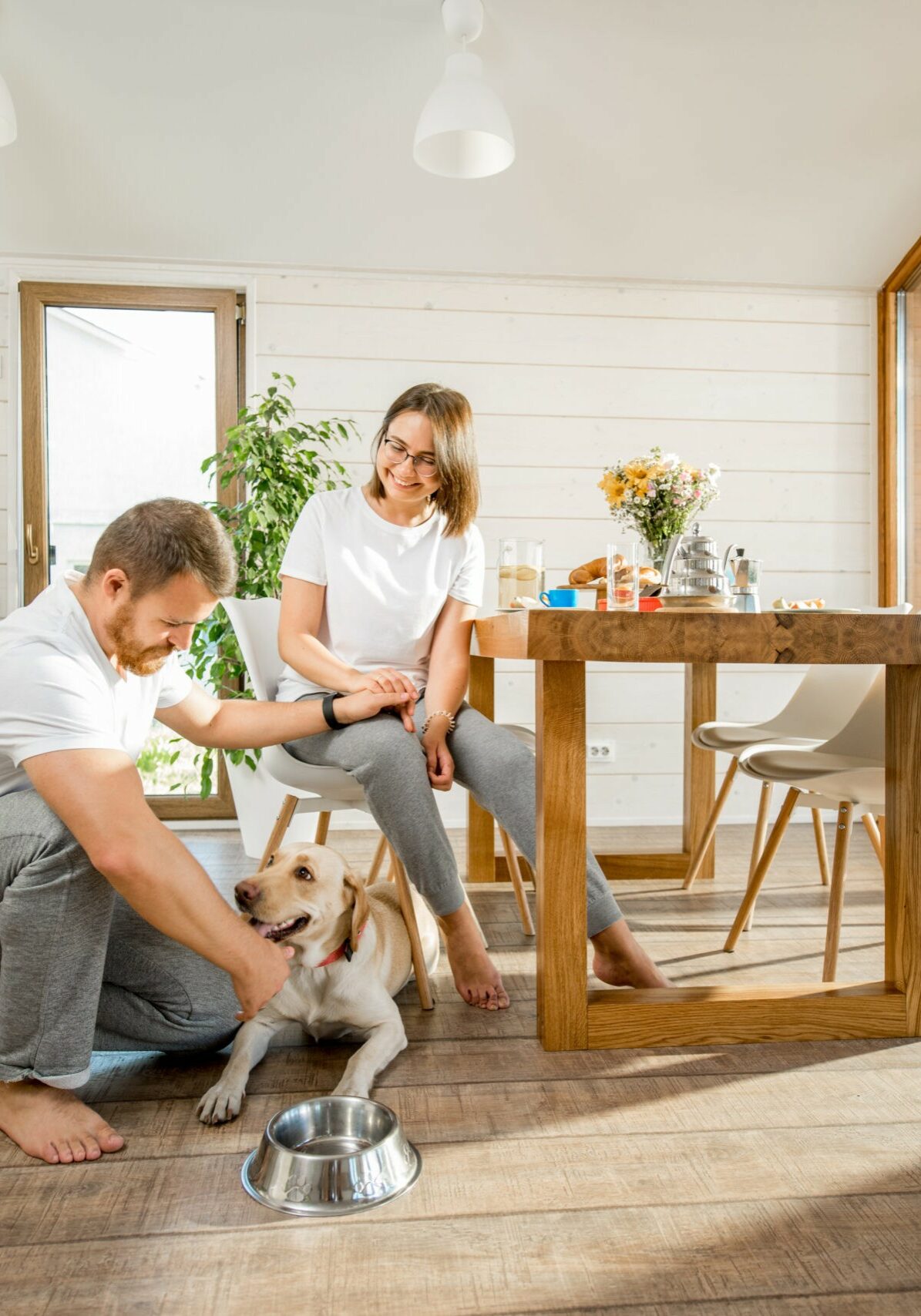 Happy couple with dog at home | Rockland Interiors