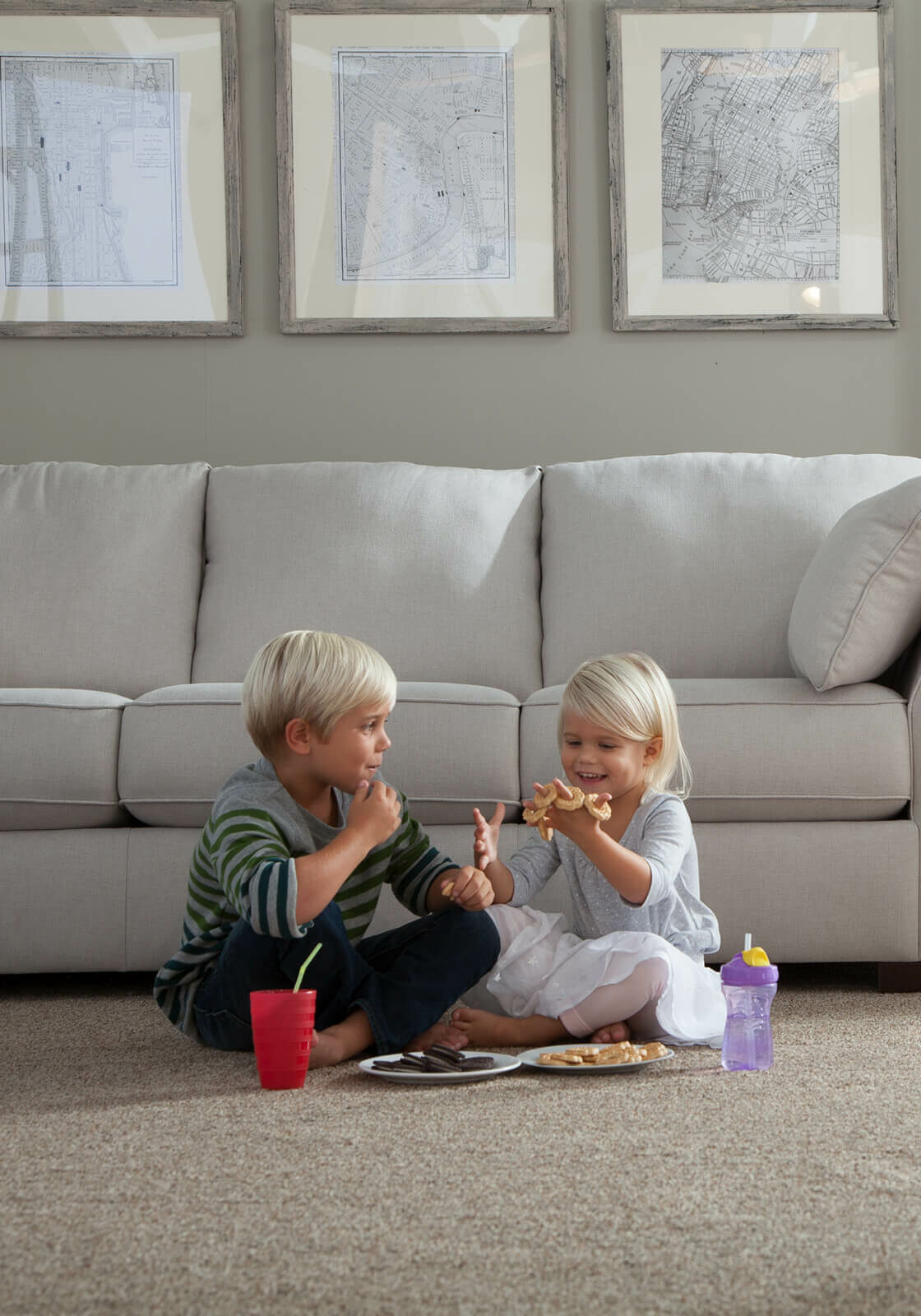 Kids enjoys food sitting on carpet floor | Rockland Interiors