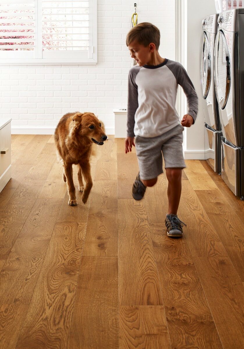 Kid running with dog | Rockland Interiors